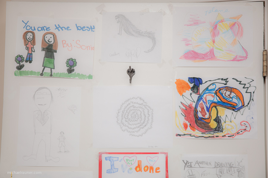 Children's artwork on the wall